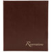 A brown leather Menu Solutions reservation binder with gold text on the cover.