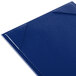 A blue Menu Solutions Kearny menu board with folded edges.