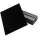 A black square Menu Solutions table sign board with a black wood base.