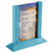 A Menu Solutions sky blue wooden table tent holding a menu on a table.