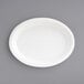An EcoChoice bagasse oval platter on a gray surface.