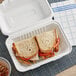 A sandwich in an EcoChoice compostable take-out container.