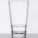 A clear plastic mixing glass with a clear rim.