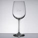 A Libbey wine glass with "Vino!" in the design.