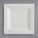 A white square EcoChoice bagasse plate on a gray surface.