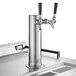 A silver metal Beverage-Air beer tap with black handles on a counter.
