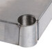An Advance Tabco solid stainless steel shelf with a hole in it.