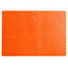 An orange paper placemat with scalloped edges.