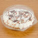 A Polar Pak clear plastic container with a high dome lid holding a pie.