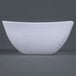A close up of a white Fineline Wavetrends plastic bowl with a curved edge.