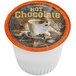 A white Caffe de Aroma hot chocolate single serve cup full of hot chocolate.