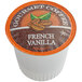 A Caffe de Aroma French Vanilla Coffee single serve cup in orange and white packaging.