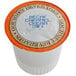A white box of Caffe de Aroma Decaf Caramel Cream coffee single serve cups with an orange and brown label.
