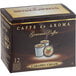 A box of Caffe de Aroma Caramel Cream coffee single serve cups on a counter.