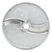 A silver circular Vollrath slicing plate with holes.