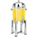 A Eastern Tabletop stainless steel beverage dispenser with a yellow liquid inside.