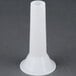 A white plastic funnel attachment for an Avantco meat grinder.