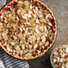 A pie with sliced almonds on top.