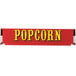 A red and yellow decal with yellow text that says "popcorn" over a red background.