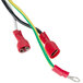 A close-up of a cable with a red and green connector.