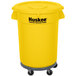 A yellow Continental Huskee round trash can with wheels.
