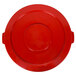 A red plastic lid with handles.