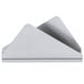 A stainless steel triangular napkin holder with a white background.