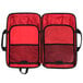 A red and black Mercer Culinary KnifePack Plus with two compartments.