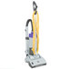 A ProTeam ProGen upright vacuum cleaner with a yellow cord and purple accents.
