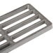A grey metal Cooking Performance Group lava briquette rack with holes.