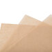 Three pieces of Bagcraft Packaging EcoCraft Bake 'N' Reuse parchment paper on a white background.
