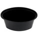 A black oval plastic souffle container with a lid. 