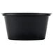 A black plastic Newspring Ellipso souffle cup with a lid.