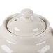 A white ceramic Hall China teapot with a lid.