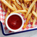 A tray of french fries with a bowl of Furmano's Fancy Grade Ketchup.