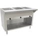 An Advance Tabco stainless steel hot food table with an enclosed base and three open wells.