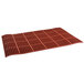 A red rubber Cactus Mat with a grid of holes.