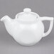 A Tuxton white china teapot with a lid.