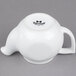 A white Tuxton teapot with a lid and handle.