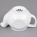 A white Tuxton china teapot with a lid and handle.