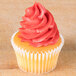 A cupcake with pink frosting piped with an Ateco closed star tip.
