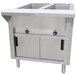 A stainless steel Advance Tabco hot food table with sliding doors.