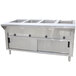 An Advance Tabco stainless steel hot food table with enclosed base and sliding doors over an open well.