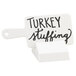 A white Cal-Mil paddle sign with the words "turkey stuffing" in black.