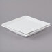 A white square porcelain plate with a square edge and a lid on top.