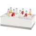 A Cal-Mil clear insert pan with six glass bottles in a cooler.