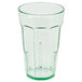 A clear plastic tumbler with a green rim.