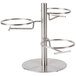 A Cal-Mil stainless steel tiered jar display with three rings holding round jars with hinged lids.
