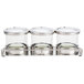 A Cal-Mil stainless steel horizontal display stand holding three glass jars with notched lids.