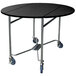 A Lakeside round top room service table with a black surface and blue wheels.